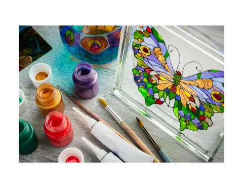 Stained glass butterfly and paint.