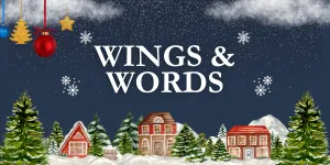 A holiday village with snow on the rooftops and the words Wings and Words